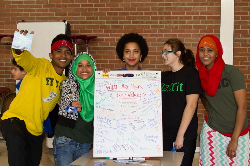 WMHS PeaceJam Club students with Core Values poster