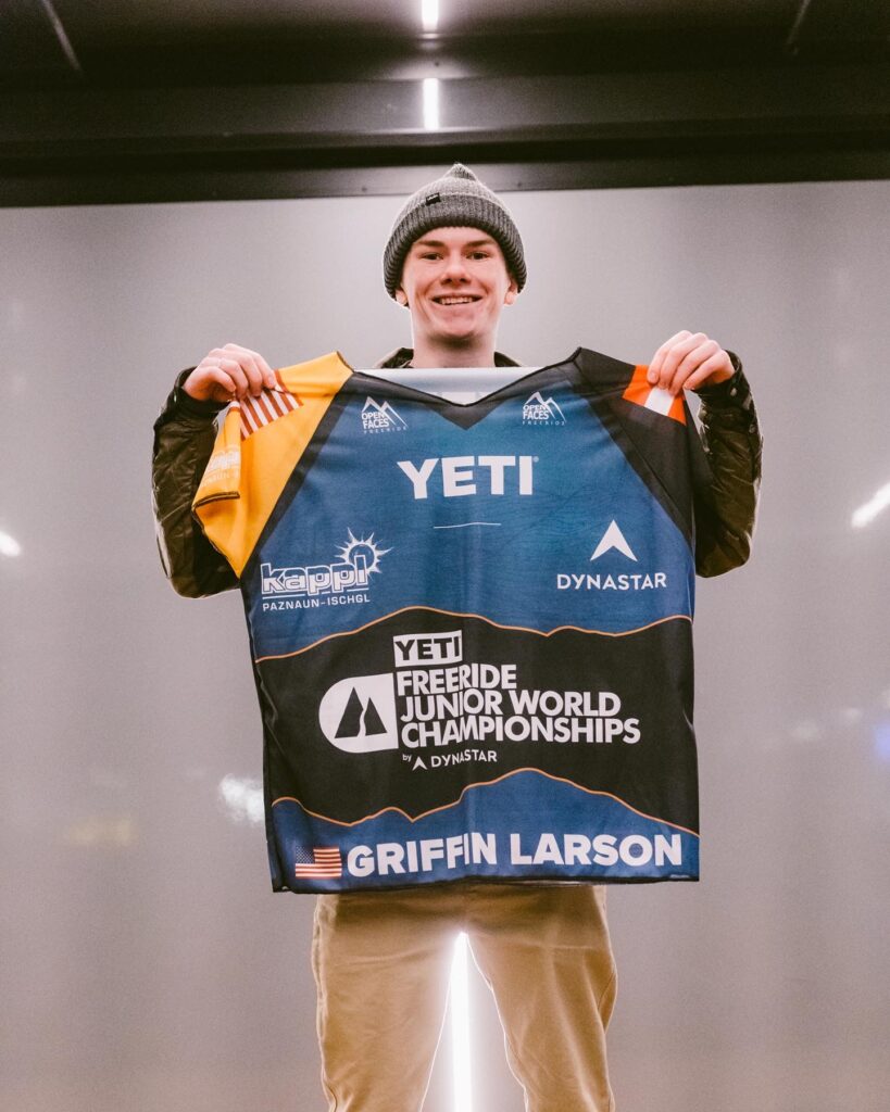 Griffin Larson holding his personalized Freeride World Championships jersey