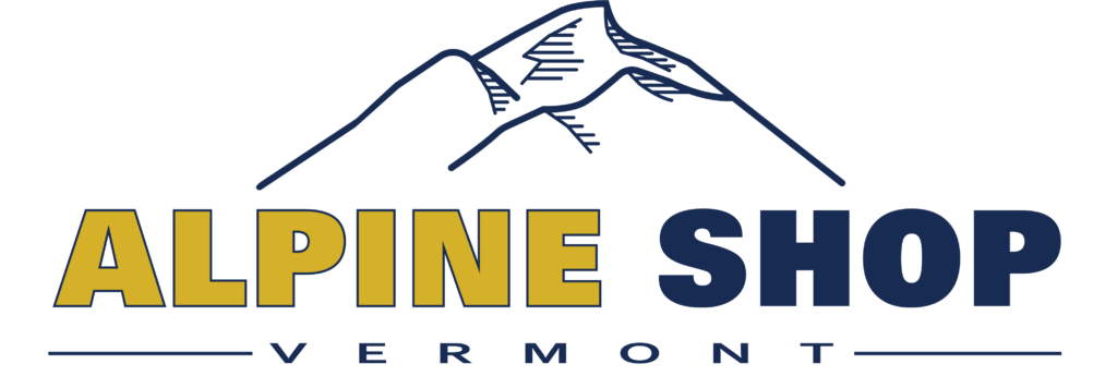 Alpine Shop logo - Mountain outline behind Alpine Shop Vermont text